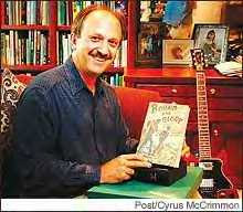 Barry Ollman at home with some of his Woody Guthrie memorabilia. Originally published in the Denver Post.